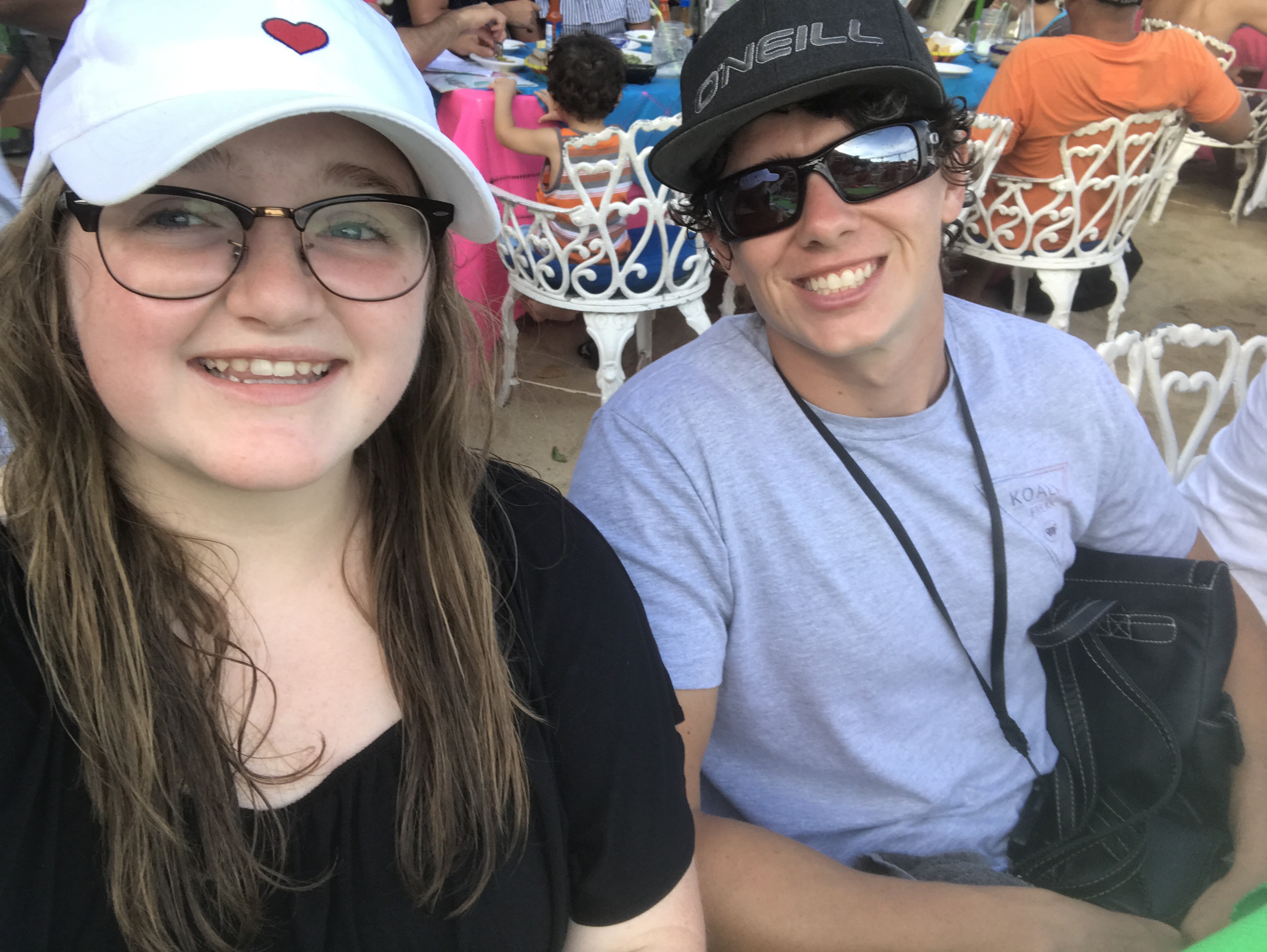 Bri and her cousin Patrick at The Office, smiling at camera