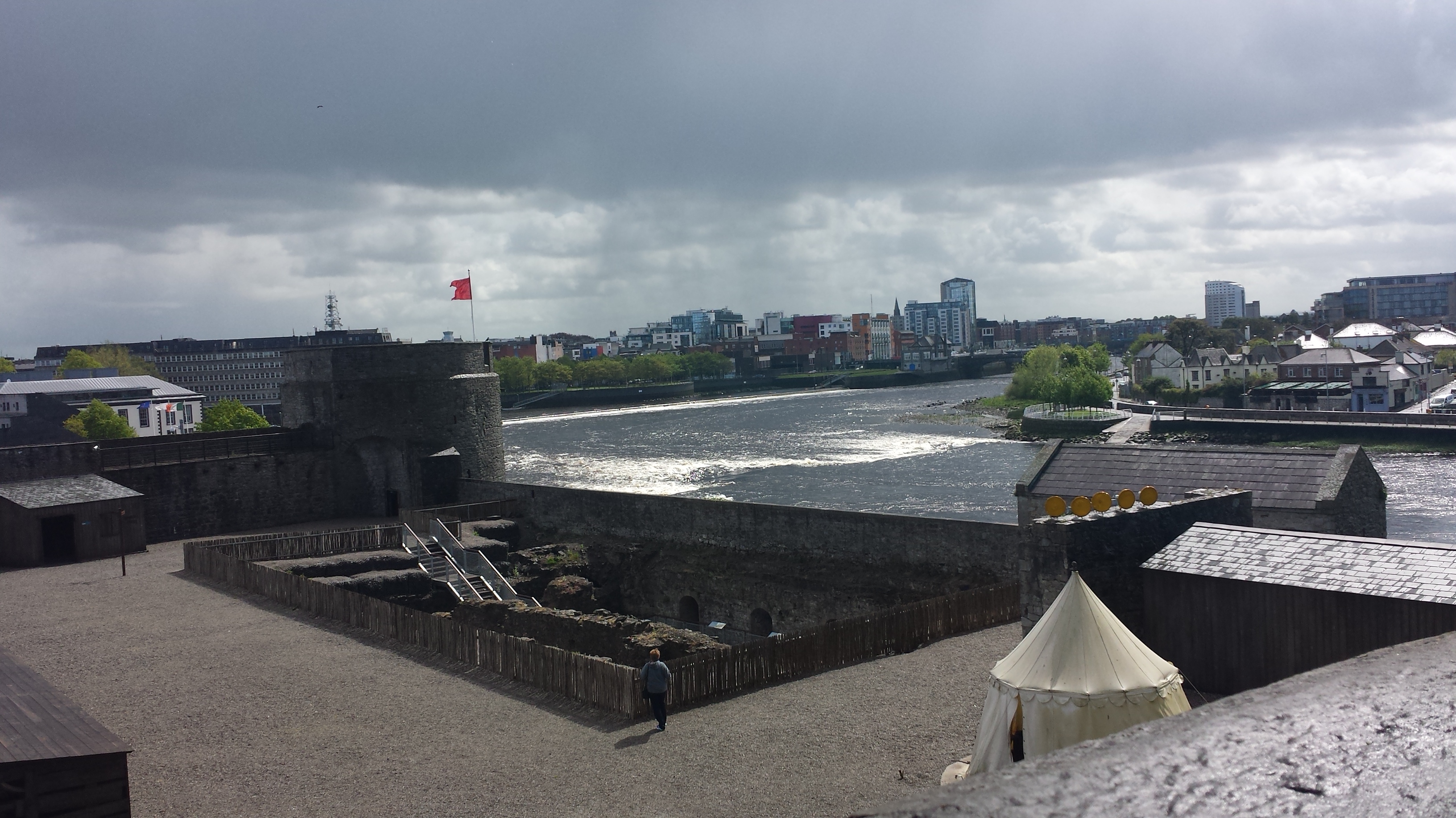 view of Limerick and the River Shannon from one of the towers of the castle. You can see the inside of the castle area as well, where the excavation goes below ground level.