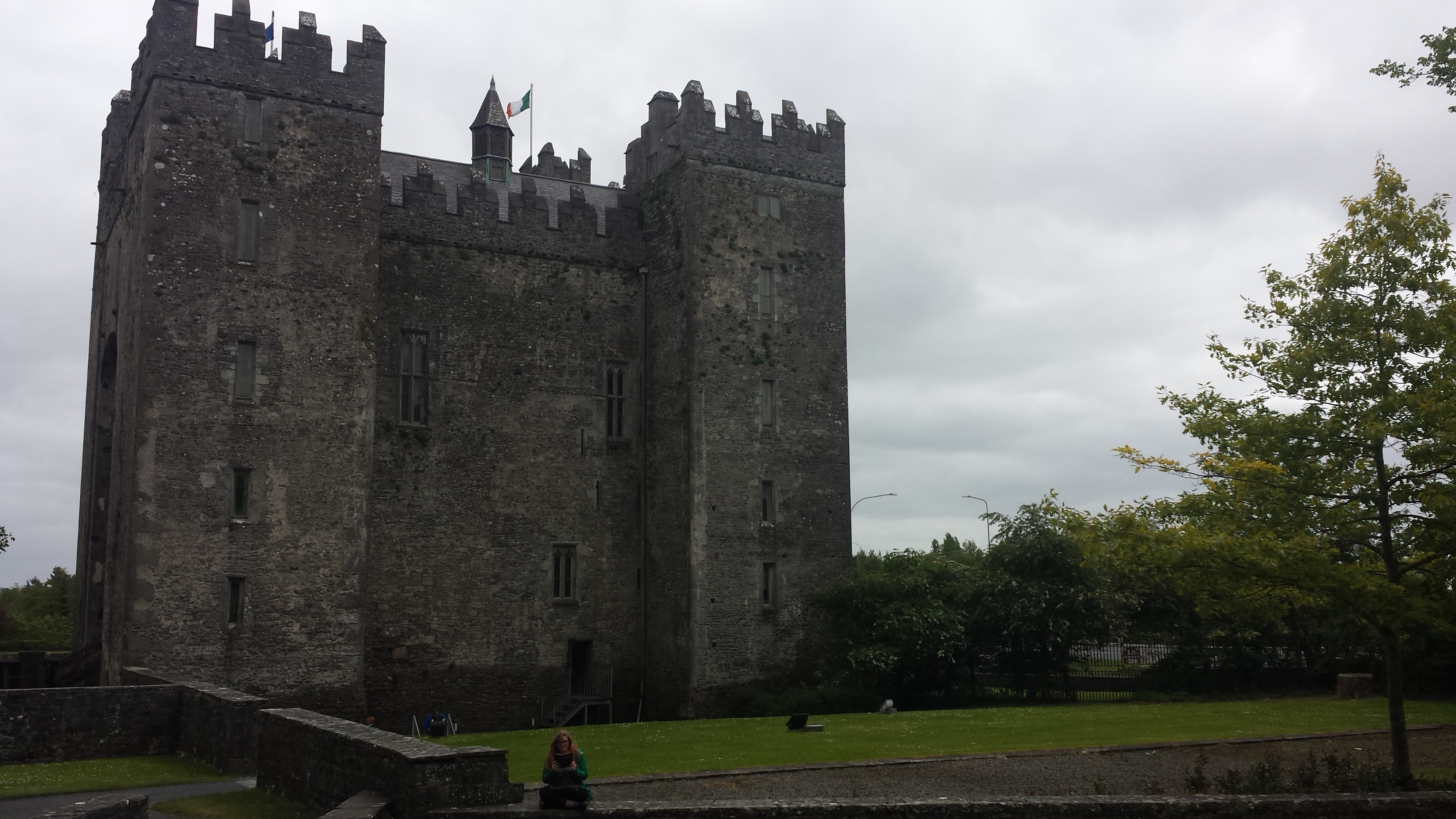 Picture of bunratty castle. It is square and has four towers.