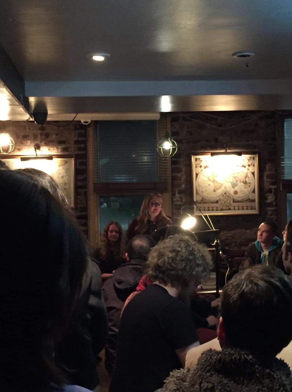 A picture of Bri reading at The Long Valley. 