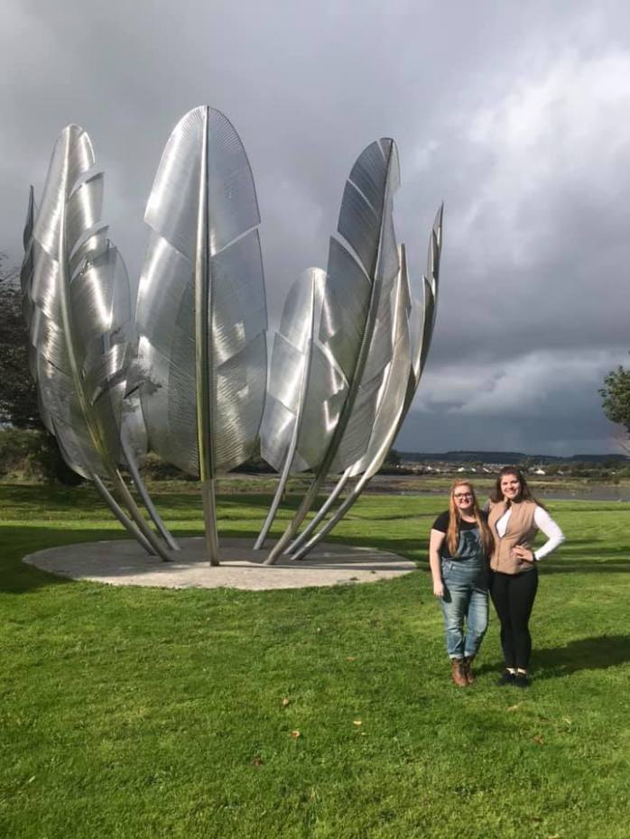 Photograph of Bri and Jessie at the Kindred Spirits Monument celebrating the relationship between Ireland and the Choctaw Nation.