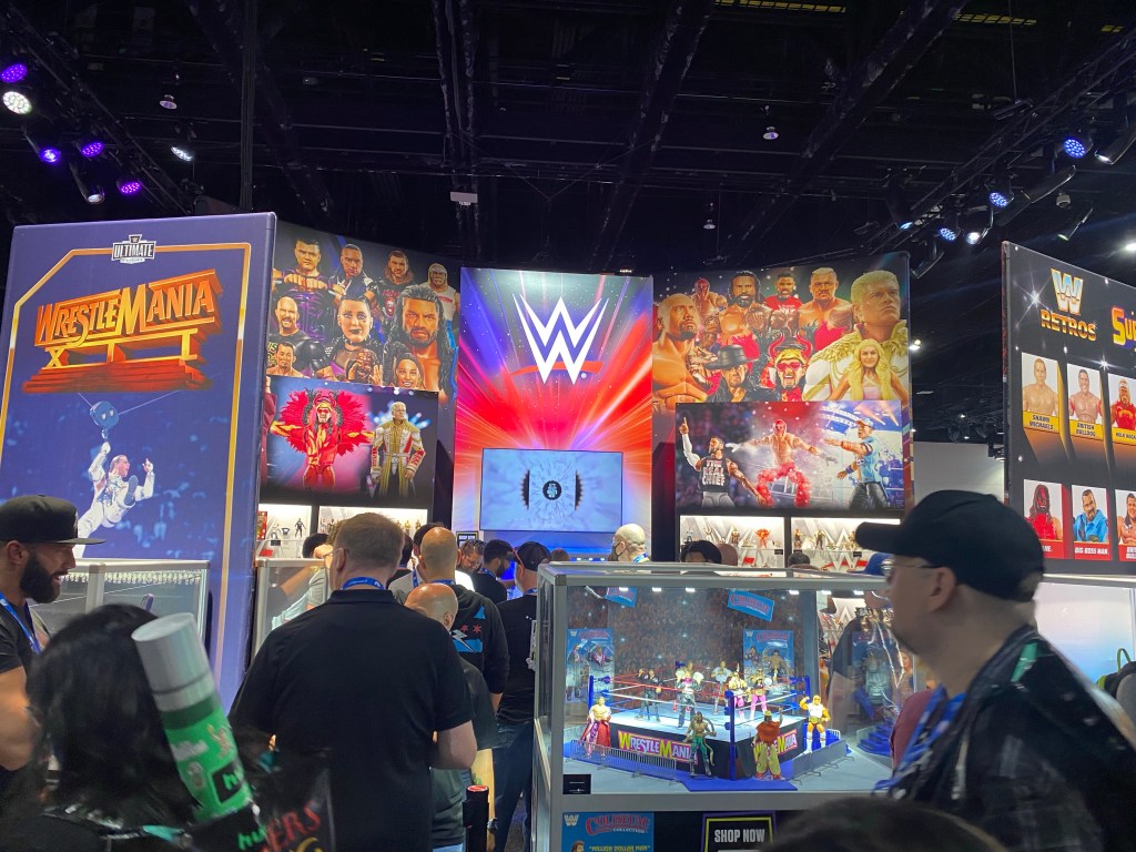 A picture of the WWE exhibit showcasing the new action figures for various WWE stars. 