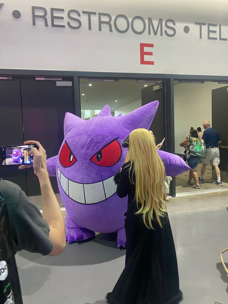 A photo of a very large Gengar from Pokemon cosplay.
